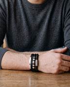 Close-up of the Atlas hexagon bead leather bracelet on a man's wrist