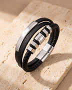 Atlas hexagon bead leather cord bracelet on warm stone