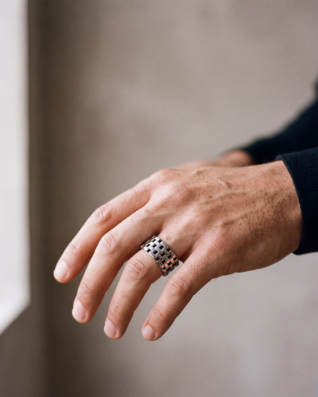 Close-up of the silver-tone Atlas Hollow Link Ring worn at true size