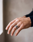 Close-up of the silver-tone Atlas Hollow Link Ring worn at true size