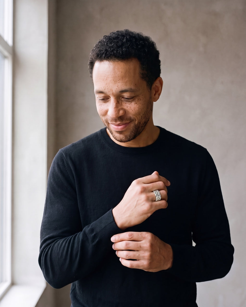 Man wearing the silver Atlas Hollow Link Ring in Stainless Steel