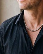 Close-up of the silver Atlas irregular bead chain worn at true size
