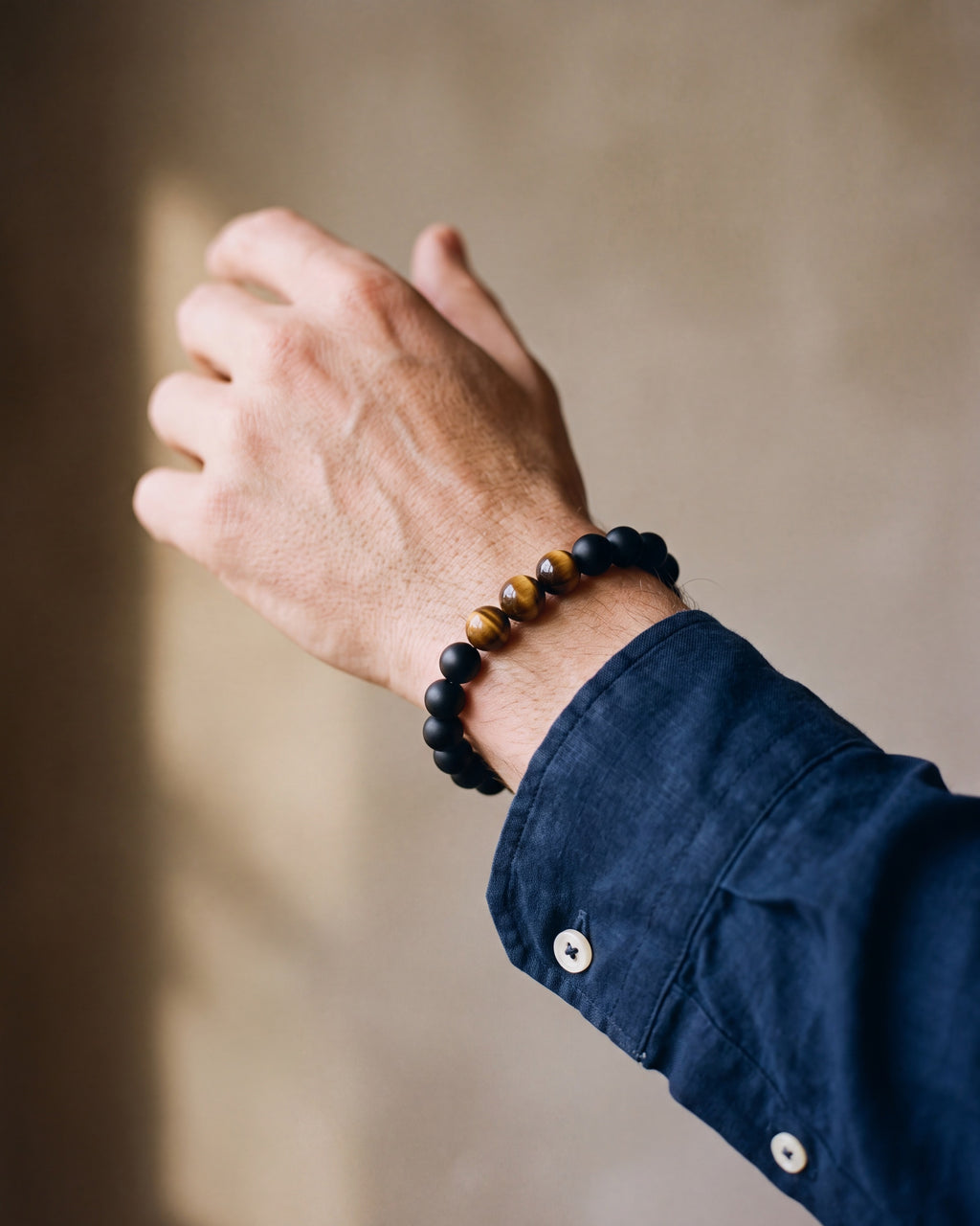 Close-up of the Black & Tiger Eye Atlas Lava and Tiger Eye Stone Bead Bracelet worn at true size