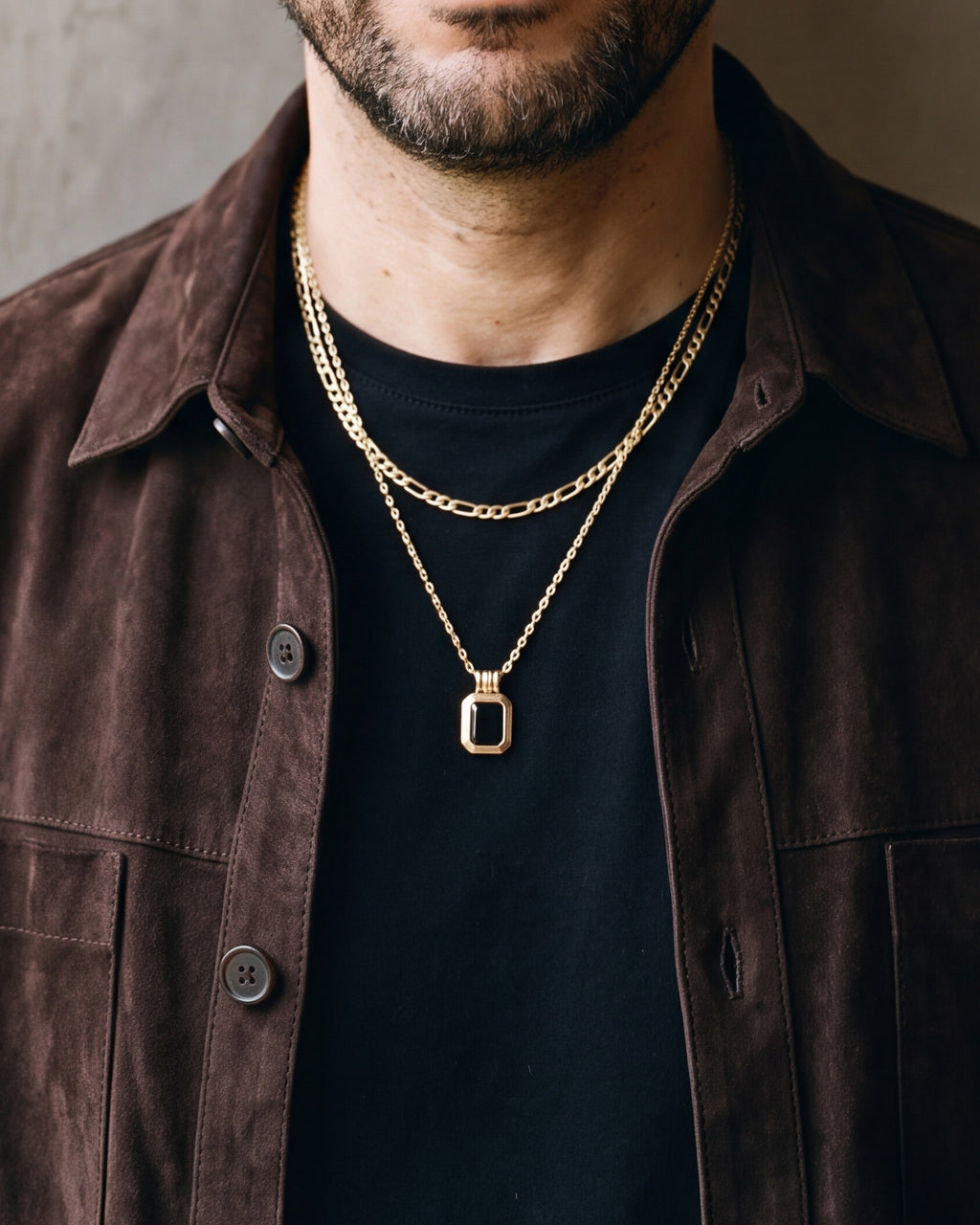Close-up of the black Atlas Layered Figaro Chain Necklace with Black Stone worn at true size