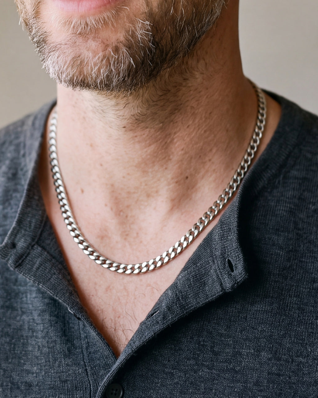 Silver Atlas Miami Cuban chain in 5 mm worn with a henley, close-up at true size