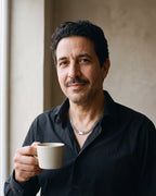Man in a black shirt holding a coffee cup, wearing the 6 mm silver Atlas mirror-polished Cuban chain