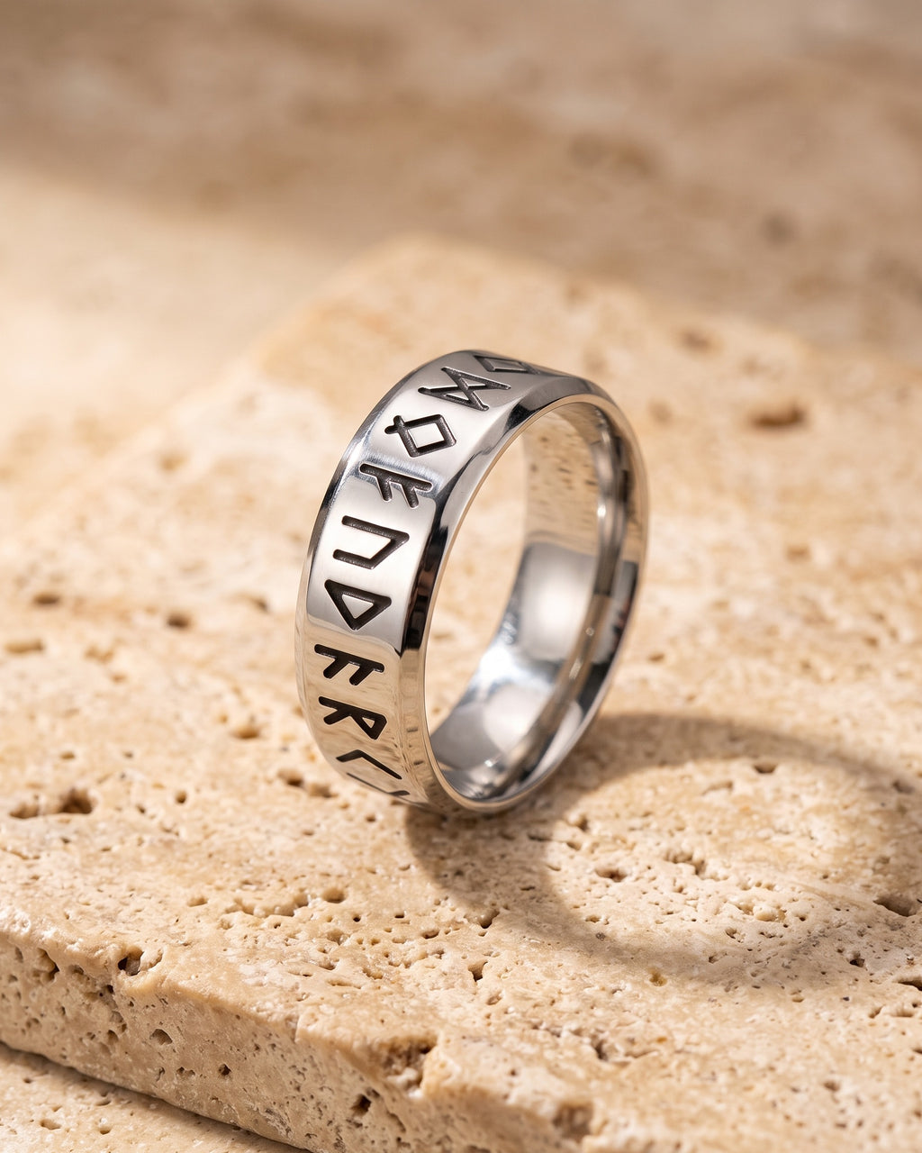 Atlas Norse rune band ring standing on warm stone