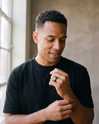 Second man in a plain heavyweight black cotton crew-neck t-shirt (thick wearing the black Atlas octagon ring