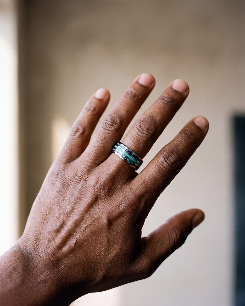 Close-up of the silver-tone Atlas opal and abalone inlay ring worn at true size