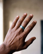 Close-up of the silver-tone Atlas opal and abalone inlay ring worn at true size