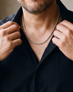 Close-up of the silver-tone Atlas Polished Rope Chain worn at true size