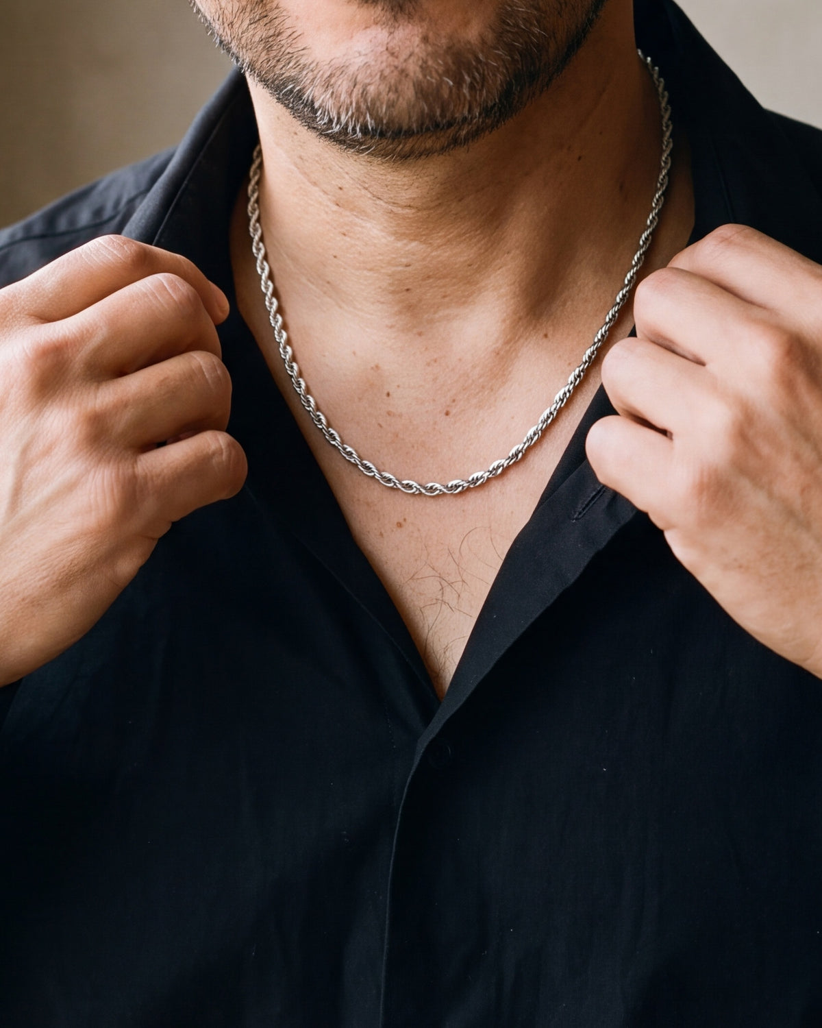 Close-up of the silver-tone Atlas Polished Rope Chain worn at true size