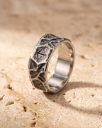 The Atlas rock texture rune ring standing on warm stone