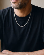 Close-up of the 4 mm Atlas rope chain on a man's neck at true size