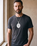 Man wearing the silver Atlas Saint Michael Pendant Necklace