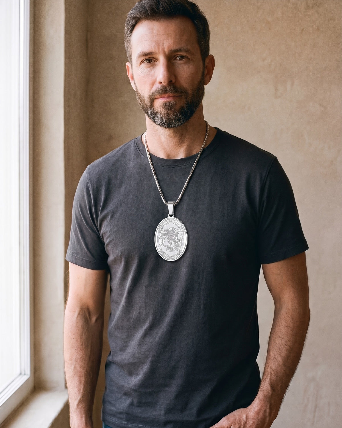 Man wearing the silver Atlas Saint Michael Pendant Necklace