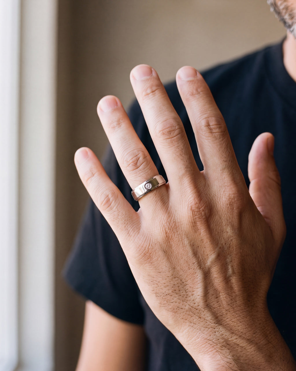 Close-up of the Atlas single cubic zirconia band on a man's hand