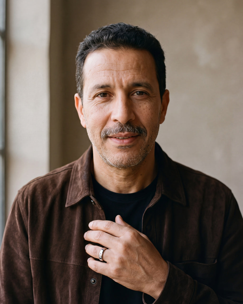 Man in a brown suede overshirt wearing the Atlas single cubic zirconia band