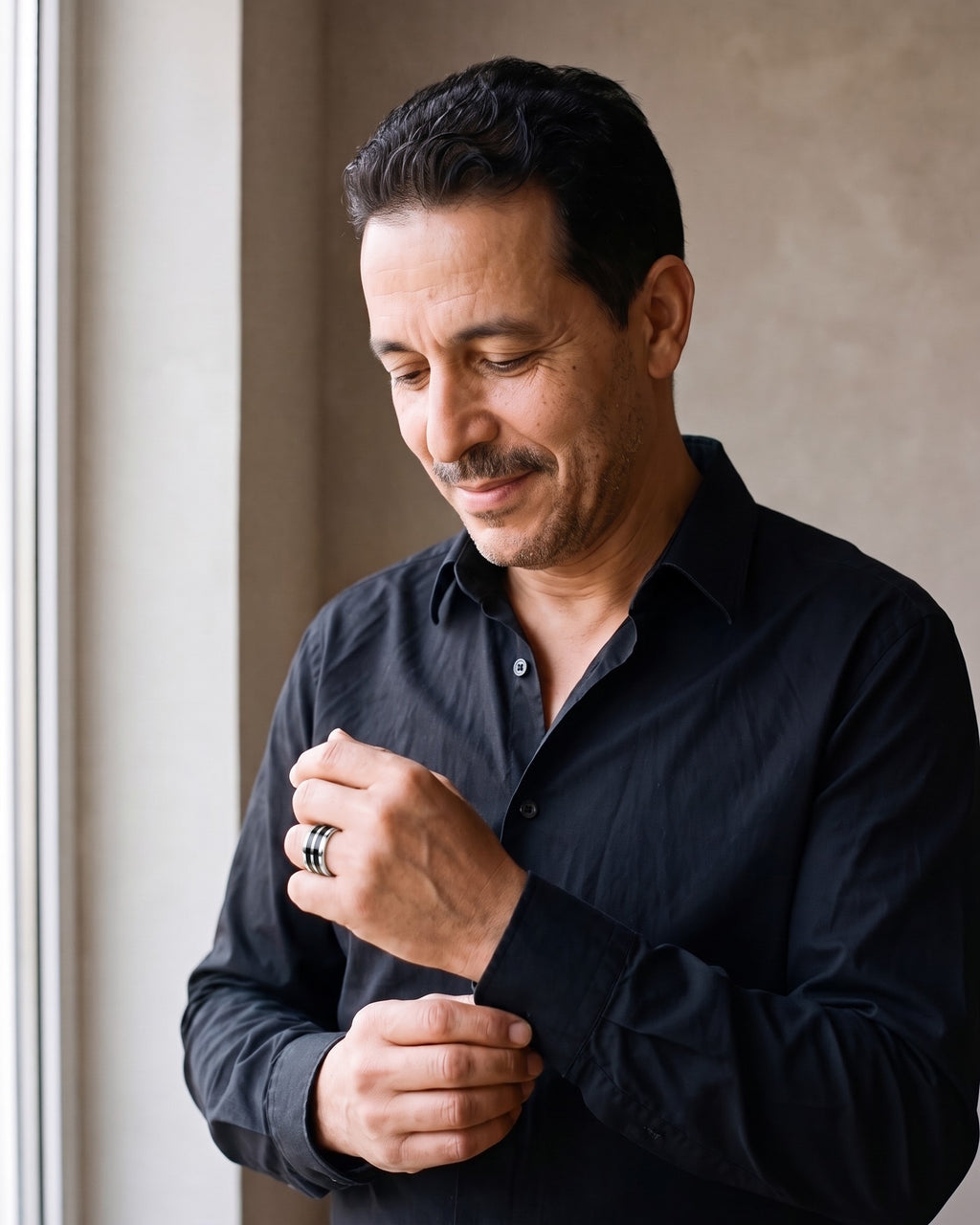 Man wearing the silver Atlas Stainless Steel Double Black Inlay Ring