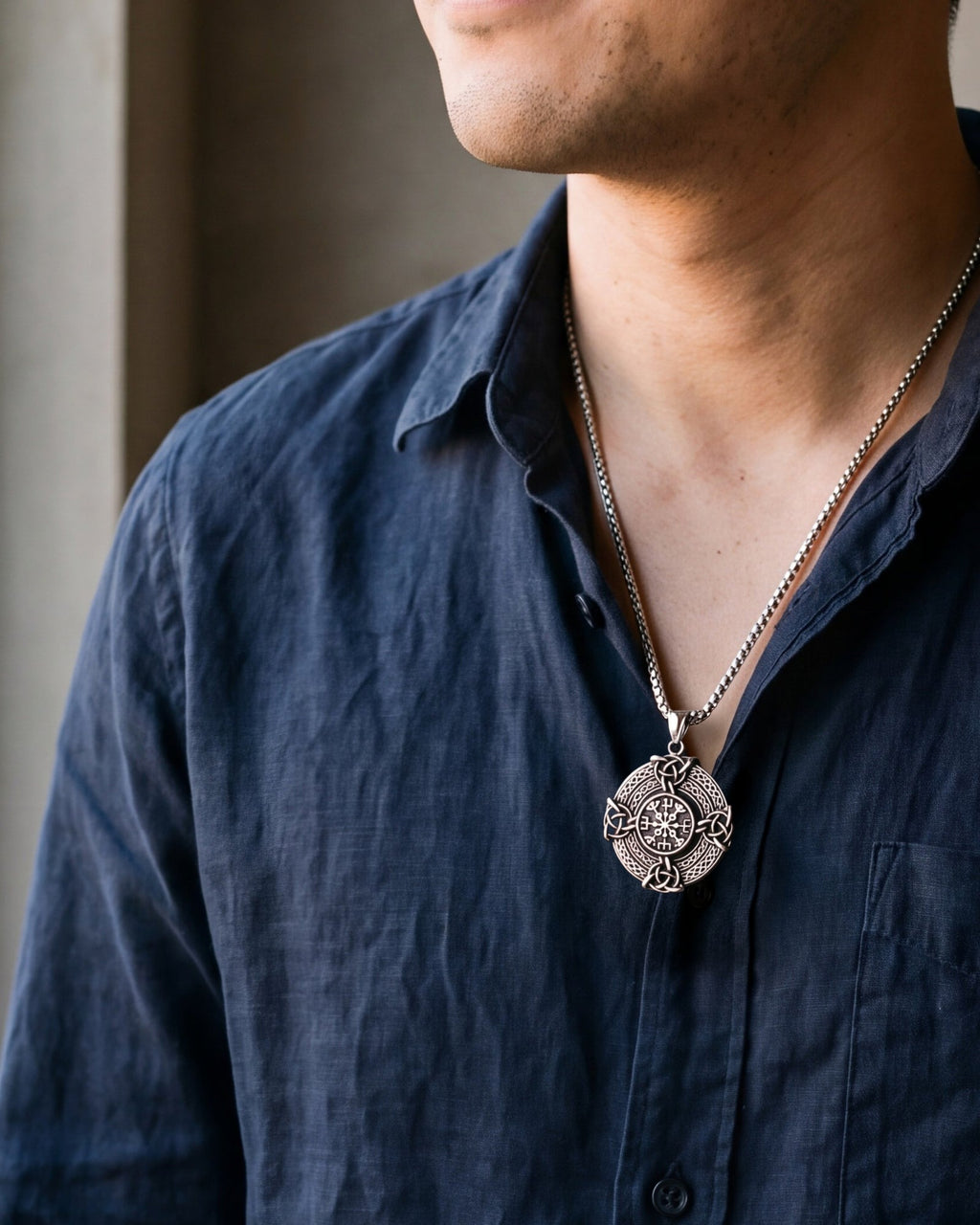 Close-up of the silver-tone Atlas Vegvisir Viking compass pendant necklace worn, true size