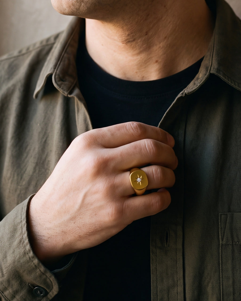 Close-up of the Atlas star signet ring on a man's hand