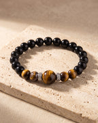Atlas tiger eye bead bracelet on warm stone