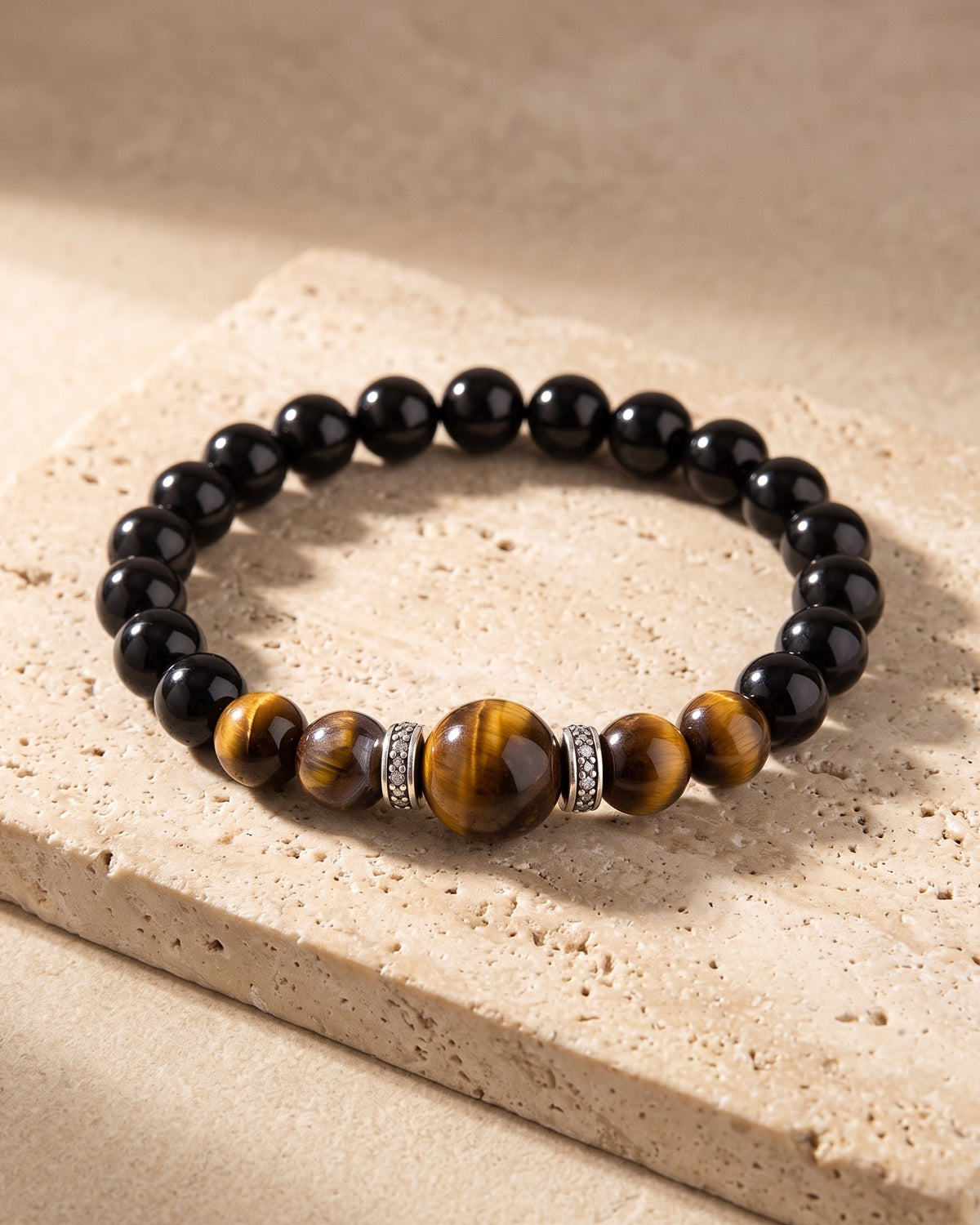 Atlas tiger eye bead bracelet on warm stone