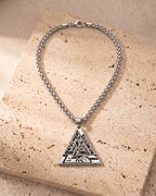 The whole Atlas Valknut triangle pendant necklace on warm stone, tree of life detail