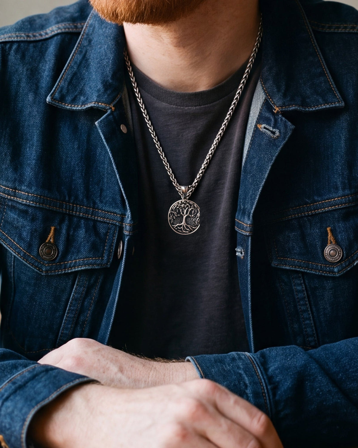 Close-up of the Atlas tree of life medallion pendant necklace in steel worn, true size