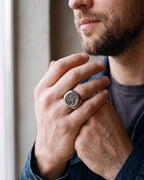 Close-up of the silver-tone Atlas tree of life signet ring worn at true size