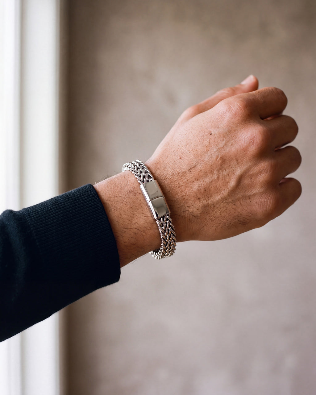 Close-up of the silver-tone Atlas twin wheat chain bracelet worn at true size