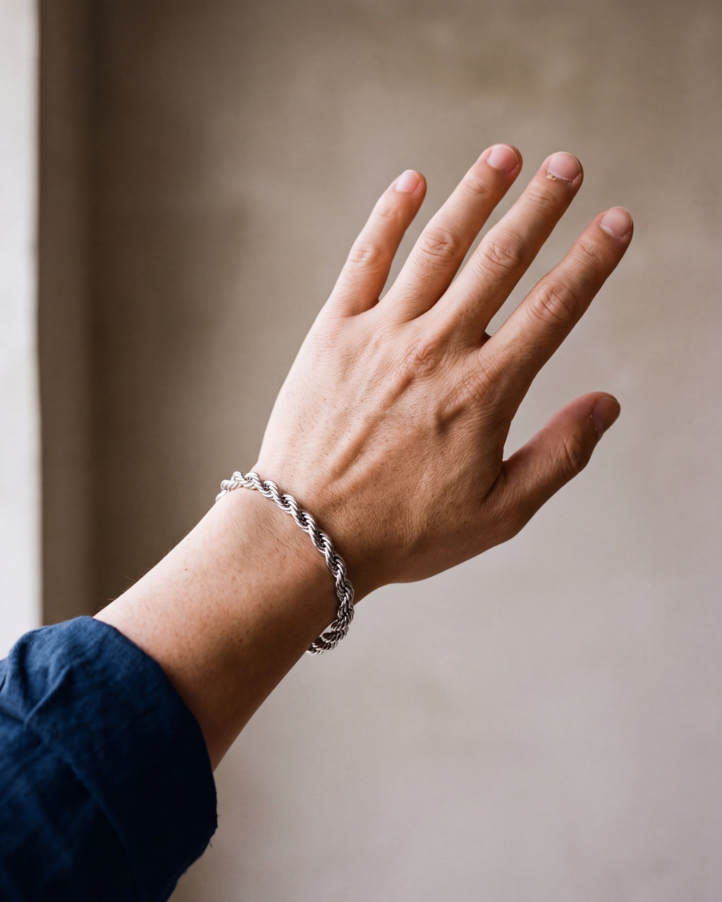 Close-up of the silver-tone Atlas Twisted Rope Bracelet worn at true size