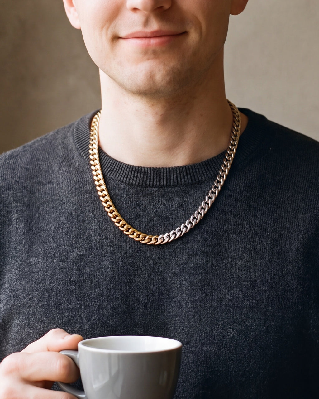 Close-up of the Atlas two-tone Cuban chain where the gold-tone and silver links meet