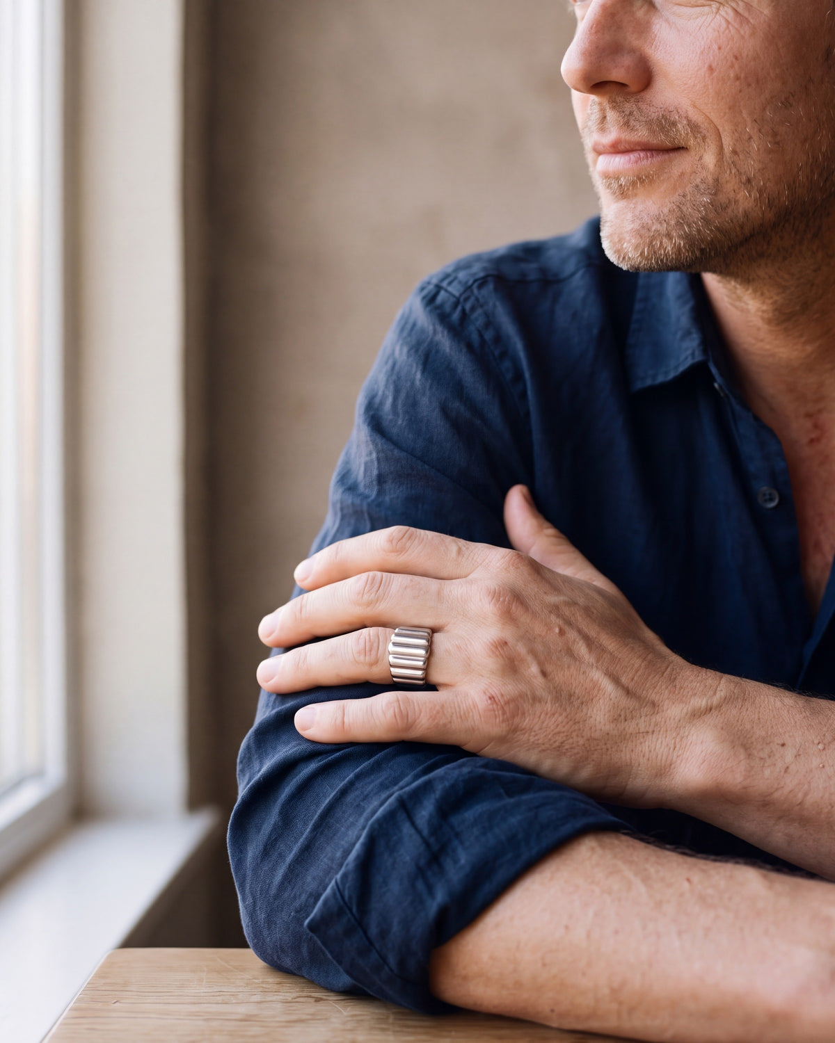 Close-up of the silver Atlas vertical stripe cuff ring worn at true size