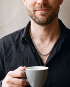Close-up of the Atlas wheat chain in silver-tone steel, worn at true size