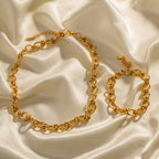 Gold-Tone Rolo Link Chain Necklace and Bracelet Set on stone view 2