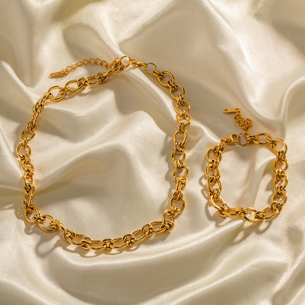 Gold-Tone Rolo Link Chain Necklace and Bracelet Set on stone view 2