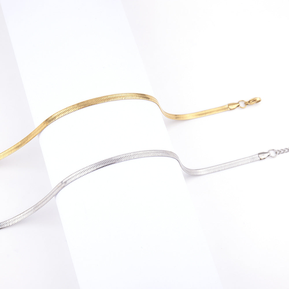 5mm Snake Chain Necklace in gold-tone stainless steel, coiled on a white background view 4