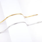 5mm Snake Chain Necklace in gold-tone stainless steel, coiled on a white background view 4