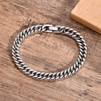 8mm Stainless Steel Curb Link Bracelet closed on wood background view 5