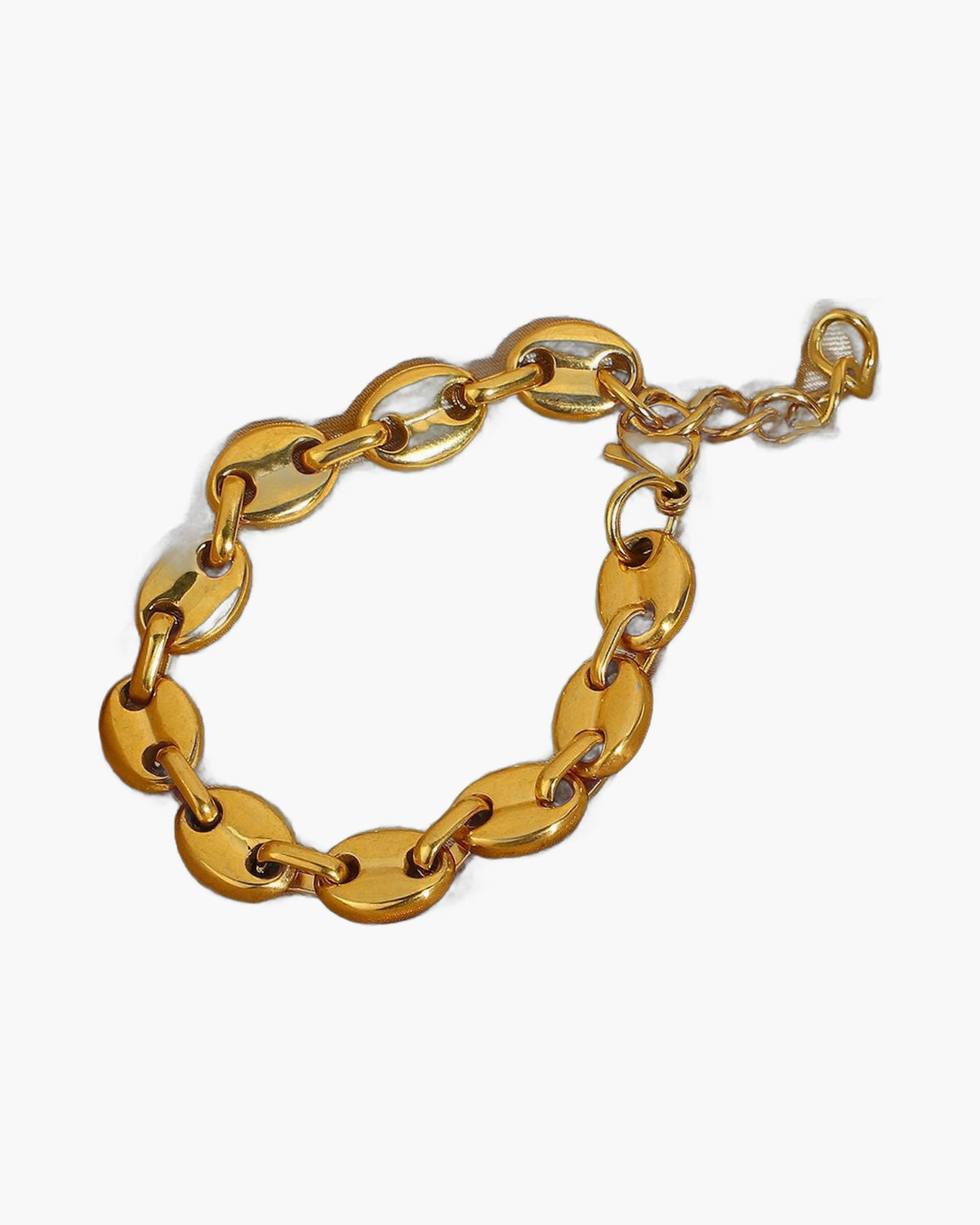 Gold-Tone Coffee Bean Link Bracelet on a light gold fabric background view 4