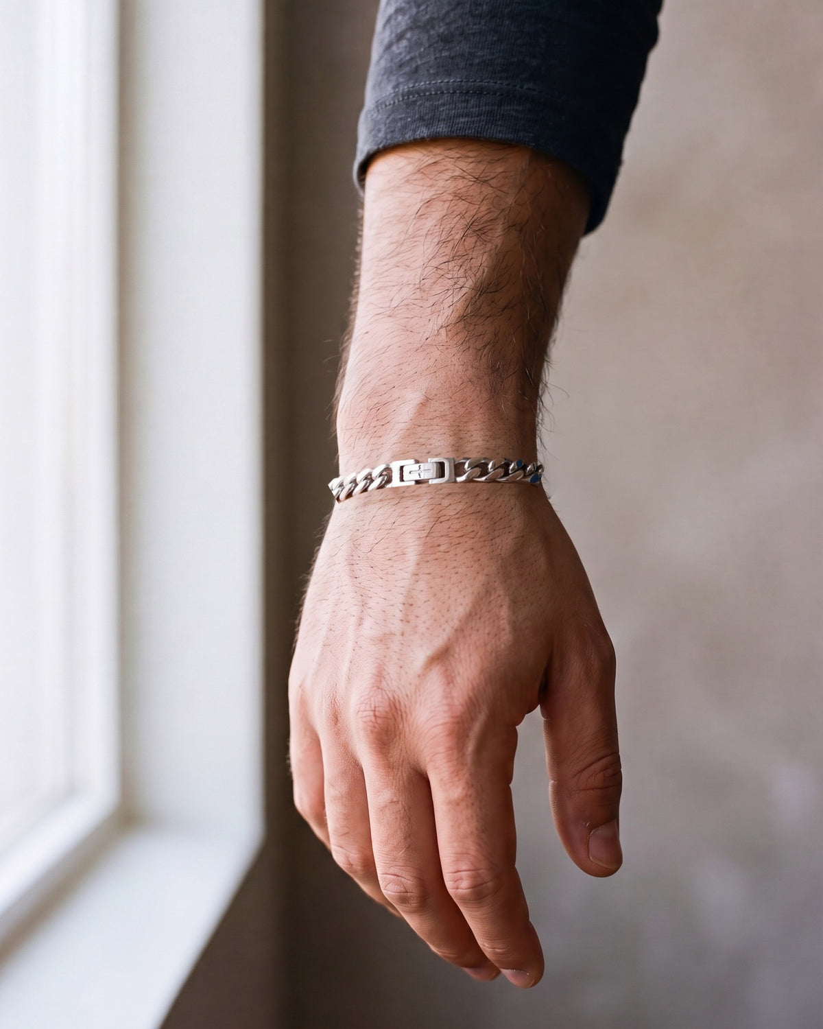 Close-up of the silver-tone Atlas Miami Cuban Bracelet worn, true size