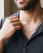 Close-up of the silver Atlas Twisted Rope Chain worn, true size